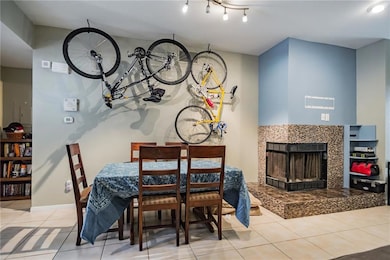 Dining space with tile patterned flooring, a tile