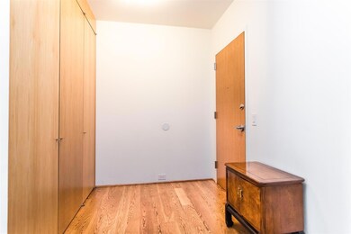 Entry Hall - wall of doors to the left is closet a