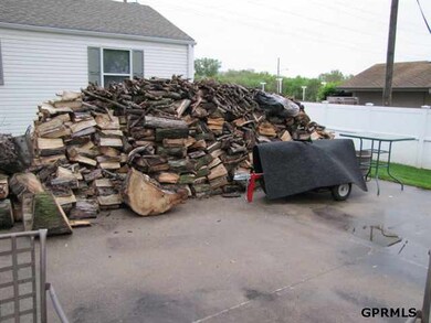 The split wood is included with the house for use in the wood burning stove in the living room.
