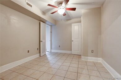 Primary Bedroom with Tile Floors, Ceiling Fan with