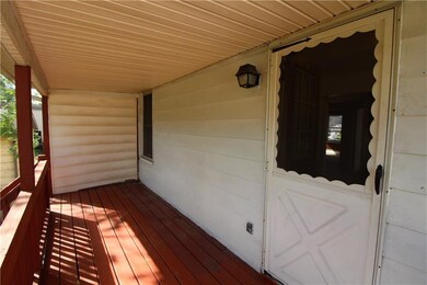 Pleasant covered deck for the upstairs unit.
