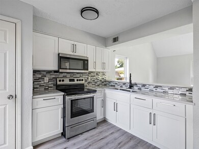 Fully updated kitchen featuring new cabinets, slee