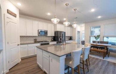 Kitchen with stainless steel appliances, a sink, 