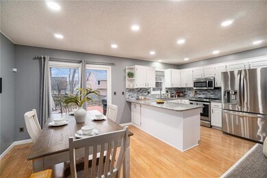 Open kitchen with dining area leading out to the u