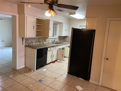 This view is from the dinning area of the kitchen and the closed door is the pantry.