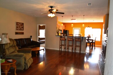 Great room has beautiful hardwood