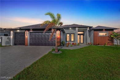 Prairie-style home with a garage, decorative drive
