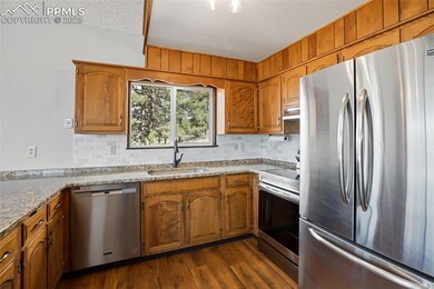Kitchen with appliances with stainless steel finis
