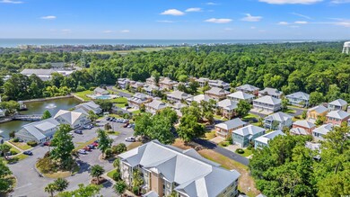 Aerial perspective of suburban area featuring a large body of water