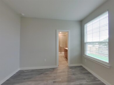Empty room with plenty of natural light, light wo