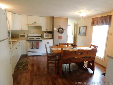 Kitchen leads to backdoor, laundry, full bathroom.