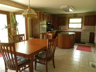 Spacious kitchen with eat in area and granite isla