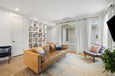 Living room with recessed lighting, baseboards, a