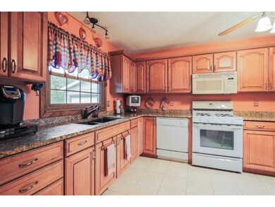 Kitchen updated with new cabinetry, granite counte
