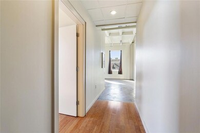 Bedroom located to the left and open living/kitche