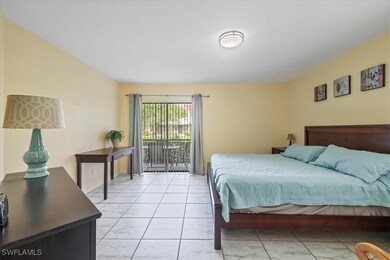 Primary bedroom with sliding glass door