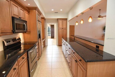 KITCHEN WITH CUSTOM CABINETS AND STAINLESS STEEL A