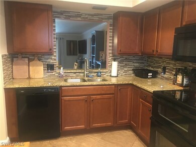 Another view of kitchen with newer black appliaces
