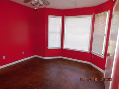 BED ROOM THREE HAS BAY WINDOWS, STAIN CONCRETE FLOOR, CEILING FAN