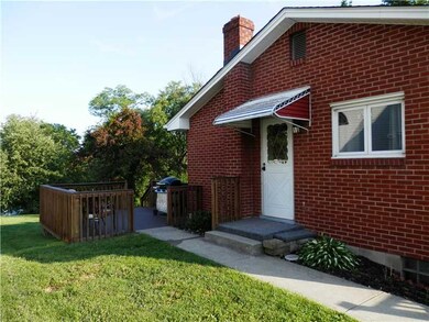 Exterior Front. Side deck overlooking the rear yar