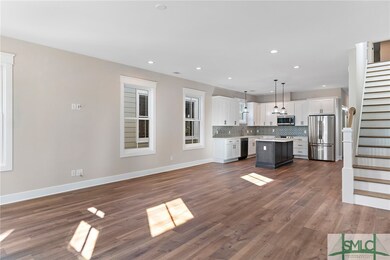 Family room and kitchen with plenty of space for d