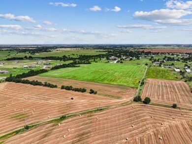 Birds eye view of property featuring a rural view