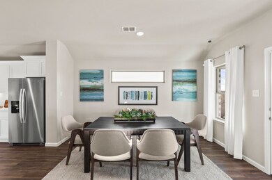 Dining room in the Heisman home plan by Trophy Signature Homes – REPRESENTATIVE PHOTO