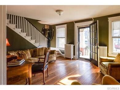 Large windows give the space light and view of front porch and wonderful walking neighborhood.