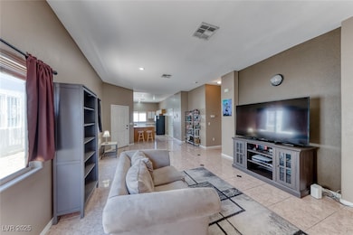 Living area with baseboards and light tile pattern