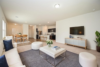 In this comfortable virtually staged scene, one can appreciate how this huge open space can comfortably accommodate full dining and living room pieces.