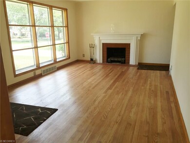 Living room with beautiful refinished hardwood flo