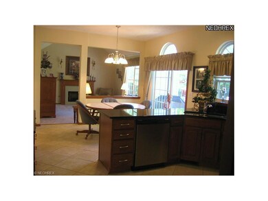Open floor plan to eat-in area and vaulted great r