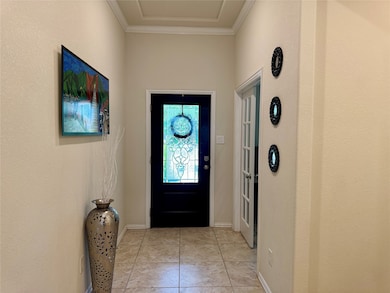 Front glass leaded door. French doors to the right