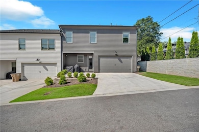 Rear Entrance to two car garage with concrete driveway