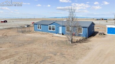 View of front of property with metal roof and fenc