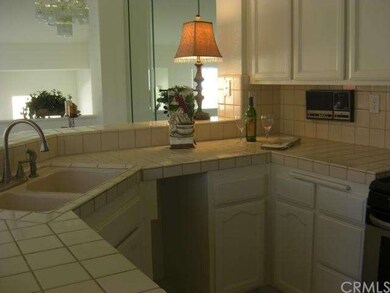 Spacious kitchen with raised counter pass through.