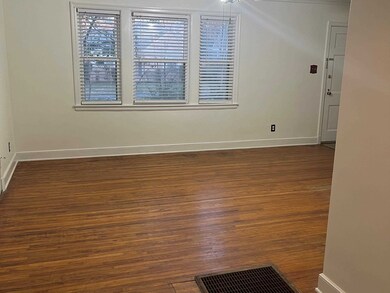 Spare room with dark hardwood / wood-style floorin