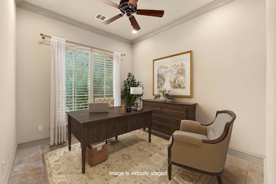 Office featuring a ceiling fan, crown molding, re