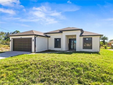 View of front of house featuring a front yard, fre