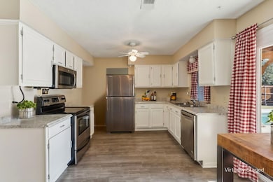 This kitchen is the heart of the home with a pictu