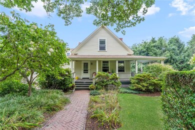 front of house.  garage is to left.  yard is to ri