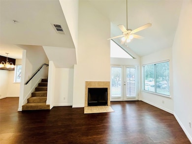 Unfurnished living room with stairs, visible vents