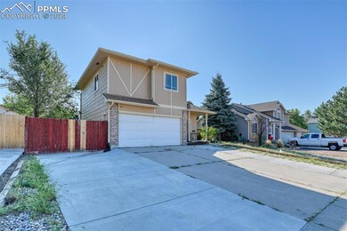 View of front facade featuring a garage