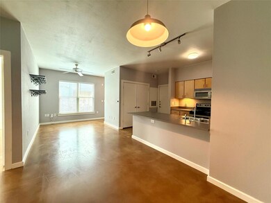 Kitchen with stainless steel appliances, baseboar