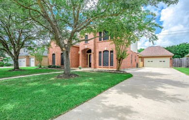 Driveway leads up to the detached garage.
