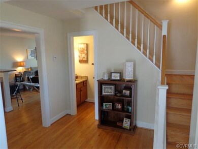 Powder room, stair case area looking into the kitc