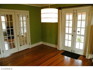 Dining Room - Modern paint and light fixture accented by classic french doors, hardwood floors and ample size for a large dining table.  Sublime!