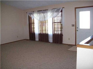 Large living room. New carpet throughout home.