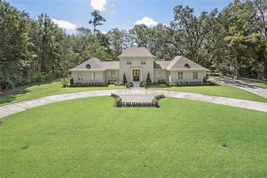 Circle drive and beautiful landscaping!
