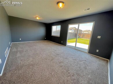 Large main level living room with walk out sliding